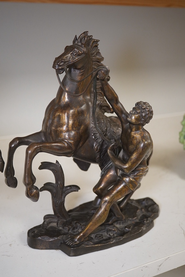 After Guillaume Coustou, a pair of dark patinated bronzes, The Marly Horses, 19th century, 25.5cm high. Condition - good.